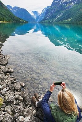 Buy stock photo Adventure woman taking photo of beautiful nature mountail lake with smart phone travel explore discover