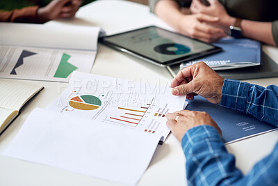 Buy stock photo businessman hands holding financial document discussing data with colleagues in meeting brainstorming ideas using graph statistics