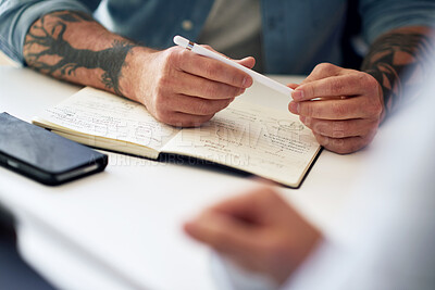 Buy stock photo Notebook, meeting and innovation planning with hands of a man writing notes during a discussion with colleague. Closeup of a businessman working on a creative business strategy in a corporate office.