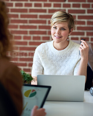 Buy stock photo beautiful business woman using laptop computer working in office sharing ideas with colleague discussing financial information on tablet screen