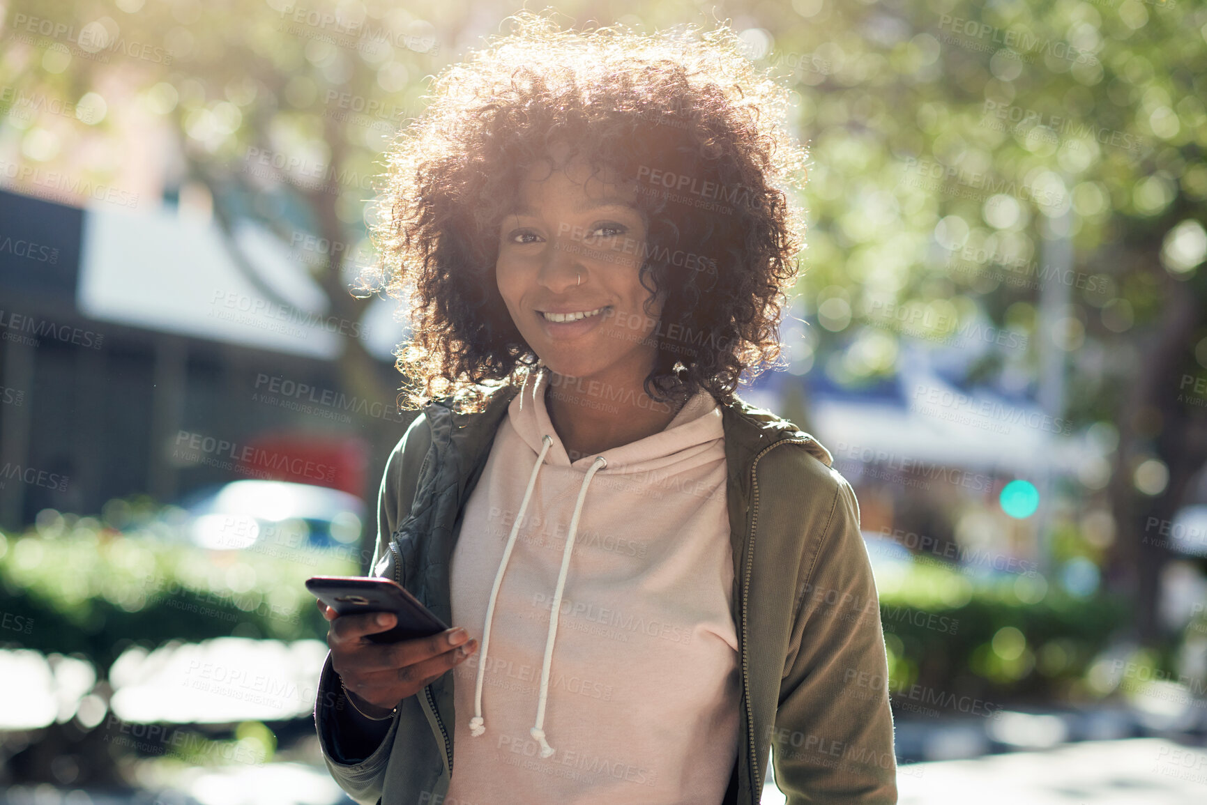 Buy stock photo beautiful african american woman using smartphone smiling looking confident in city street on sunny day