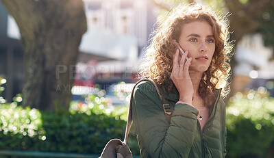 Buy stock photo beautiful woman using smartphone having phone call talking on mobile phone in city street with morning sun flare
