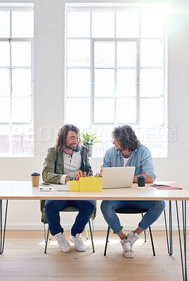 Buy stock photo College students working together two young men brainstorming ideas for project sitting at desk using laptop computer in class