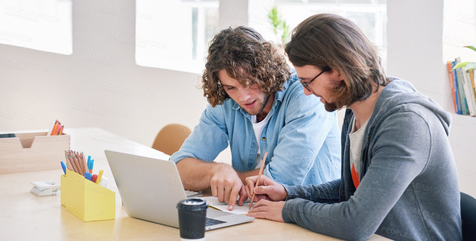 Buy stock photo College students working together two young men brainstorming ideas for project sitting at desk using laptop computer in class