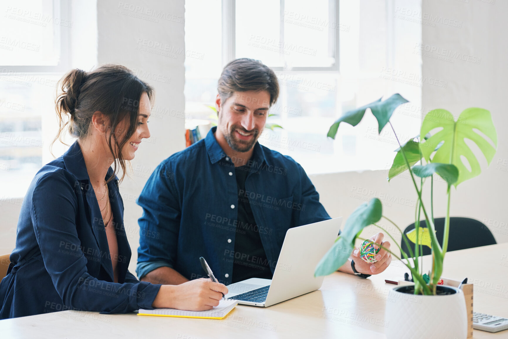 Buy stock photo Two business people using laptop computer colleagues working in office sharing ideas