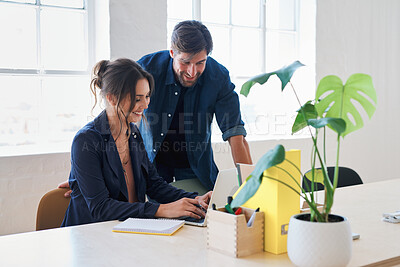 Buy stock photo Two business people using laptop computer colleagues working in office sharing ideas