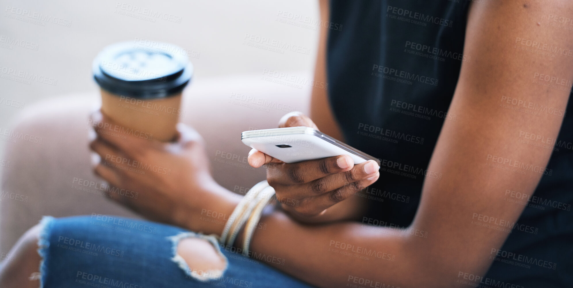 Buy stock photo Woman using smartphone browsing messages on social media texting on mobile phone holding coffee