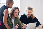 Young business people using laptop computer brainstorming ideas sitting at table in office