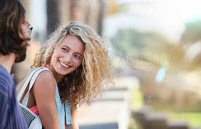 Buy stock photo Beautiful woman smiling chatting to boyfriend happy couple enjoying summer relaxing together outdoors