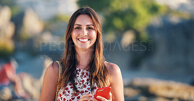 Buy stock photo Beautiful woman smiling on beach at sunset holding smartphone enjoying travel vacation lifestyle