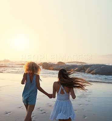 Buy stock photo woman friends running on beach at sunset holding hands having fun summer vacation enjoying freedom