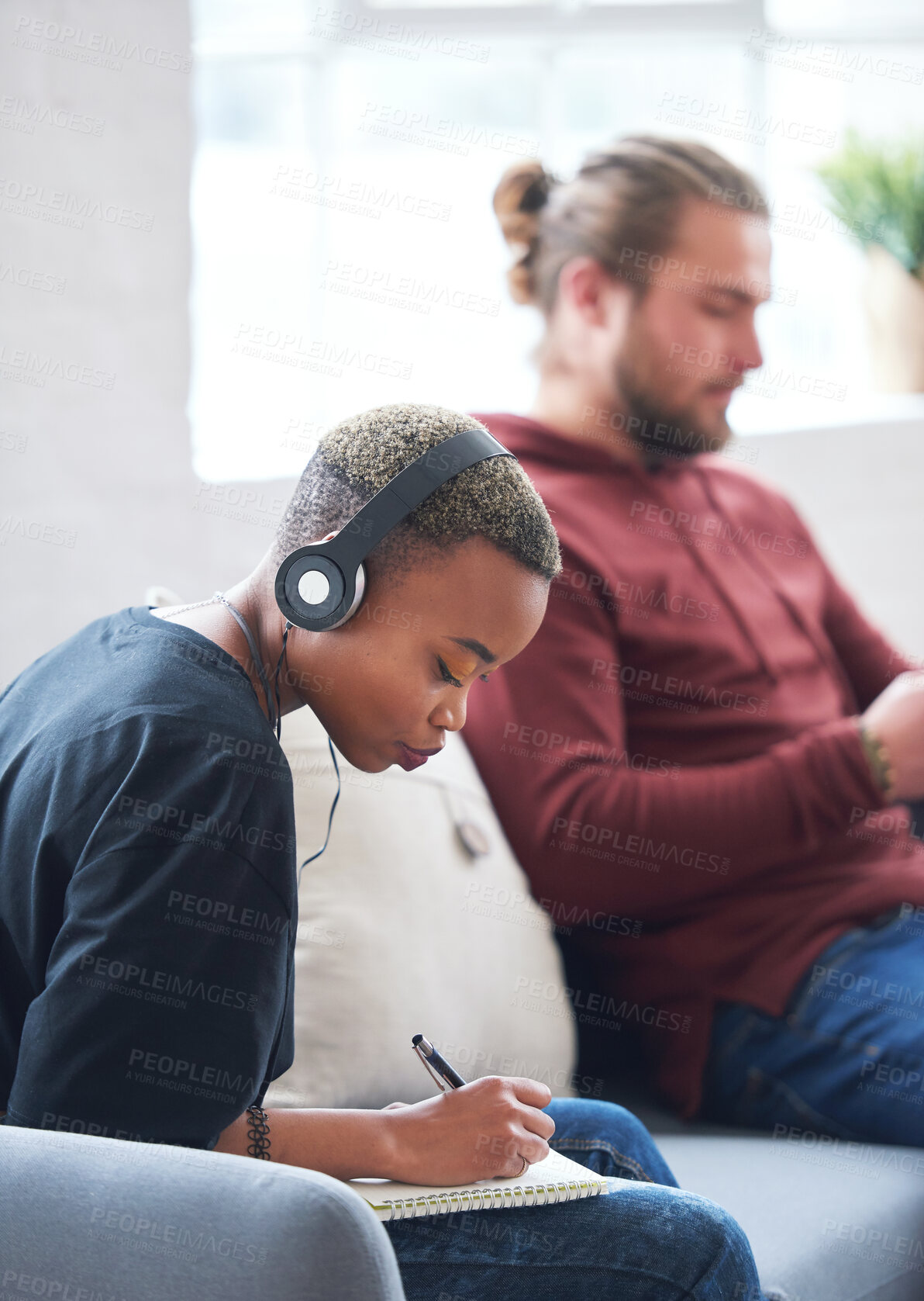 Buy stock photo Student, black woman with music writing in notebook for schedule, planning or learning while listening to podcast or radio. Thinking, studying or working girl in college, university or school