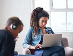 Young woman with dreadlocks using laptop computer browsing internet female student working on project sitting in internet cafe