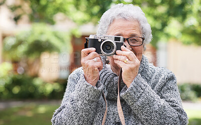 Buy stock photo Elderly woman, camera and photography in retirement hobby in garden, relax pension or outdoor. Female person, digital equipment and smile for skill development in old age, shooting or fun leisure