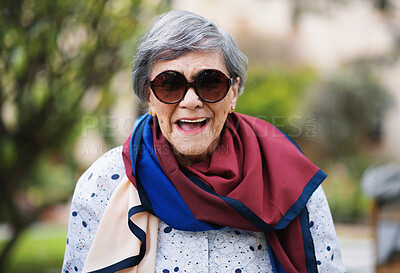 Buy stock photo Laughing, senior woman and garden or park with smile from walk, spring and nature. Elderly female person, happy and outdoor of retirement home or on vacation with travel in London with sunglasses
