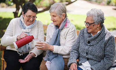 Buy stock photo Old woman, friends and park for coffee drink out flask for winter bonding, retirement connection on bench. Senior people, warm beverage and relax in nature outdoor for conversation, gossip or hot tea