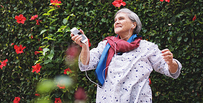 Buy stock photo Phone, senior woman and music with dancing in garden or park with smile in nature. Elderly female person, audio and outdoor of retirement home or on vacation with travel and flowers with freedom