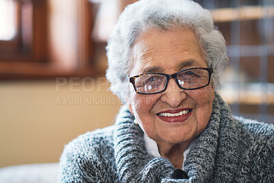 Buy stock photo Portrait beautiful elderly woman smiling sitting on sofa at home enjoying retirement