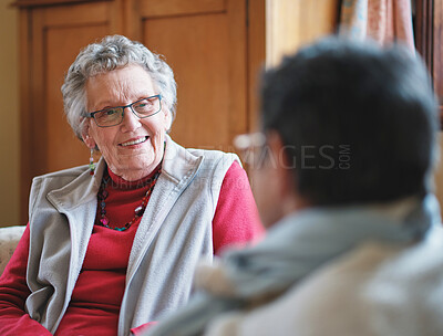 Buy stock photo Elderly woman, talking and friends in home together or retirement connection, communication or relax. Female person, smile and conversation bonding for speaking in lounge for love, care or support