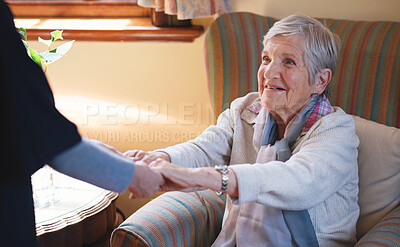 Nurse helping old woman holding hands in retirement home