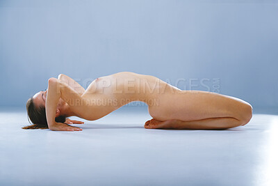 Buy stock photo Studio shot of a beautiful naked woman doing yoga