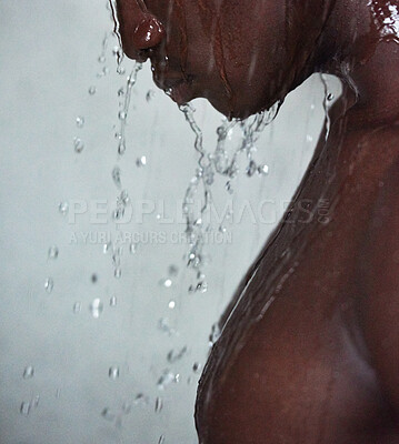Buy stock photo Cropped shot of a handsome young man taking a shower at home