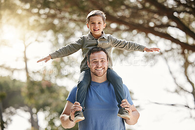 Buy stock photo Happy caucasian father and son having fun and playing together outside. Carefree man carrying excited son on his shoulders while bonding in at the park. Single dad enjoying quality time with kid