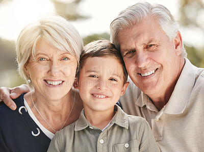 Buy stock photo Portrait of loving caucasian grandparents enjoying time with grandson in nature. Smiling little boy bonding with grandmother and grandfather. Happy seniors and child smiling and looking at the camera