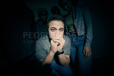 Buy stock photo One mixed race male suffering mental illness in asylum. Caucasian schizophrenic man experiencing a breakdown while being surrounded by people on a stage theatre performance