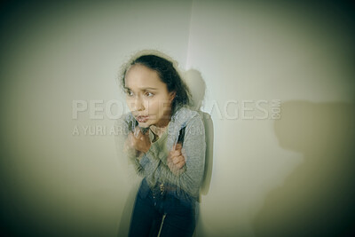 Buy stock photo One mixed race female suffering mental illness in an asylum. Hispanic woman having a panic attack after being kidnapped for human trafficking. Bipolar female feeling crazy.  Rape victim with ptsd