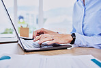 Close up hands of business woman typing on laptop keyboard. Female entrepreneur sending an email online