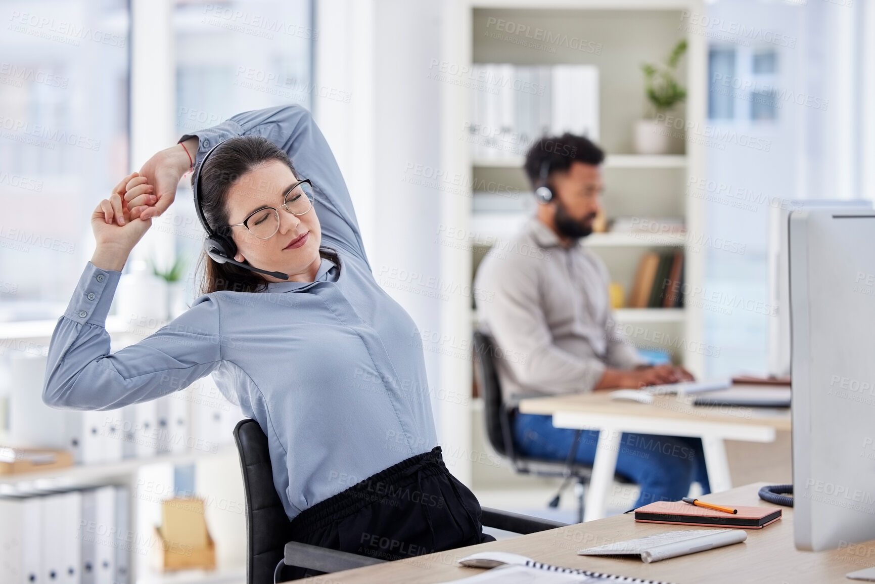 Buy stock photo Consultant, lazy woman call center agent with stretch and tired at her desk with a computer of workplace. Online communication or telemarketing, burnout and female person stretching for fatigue