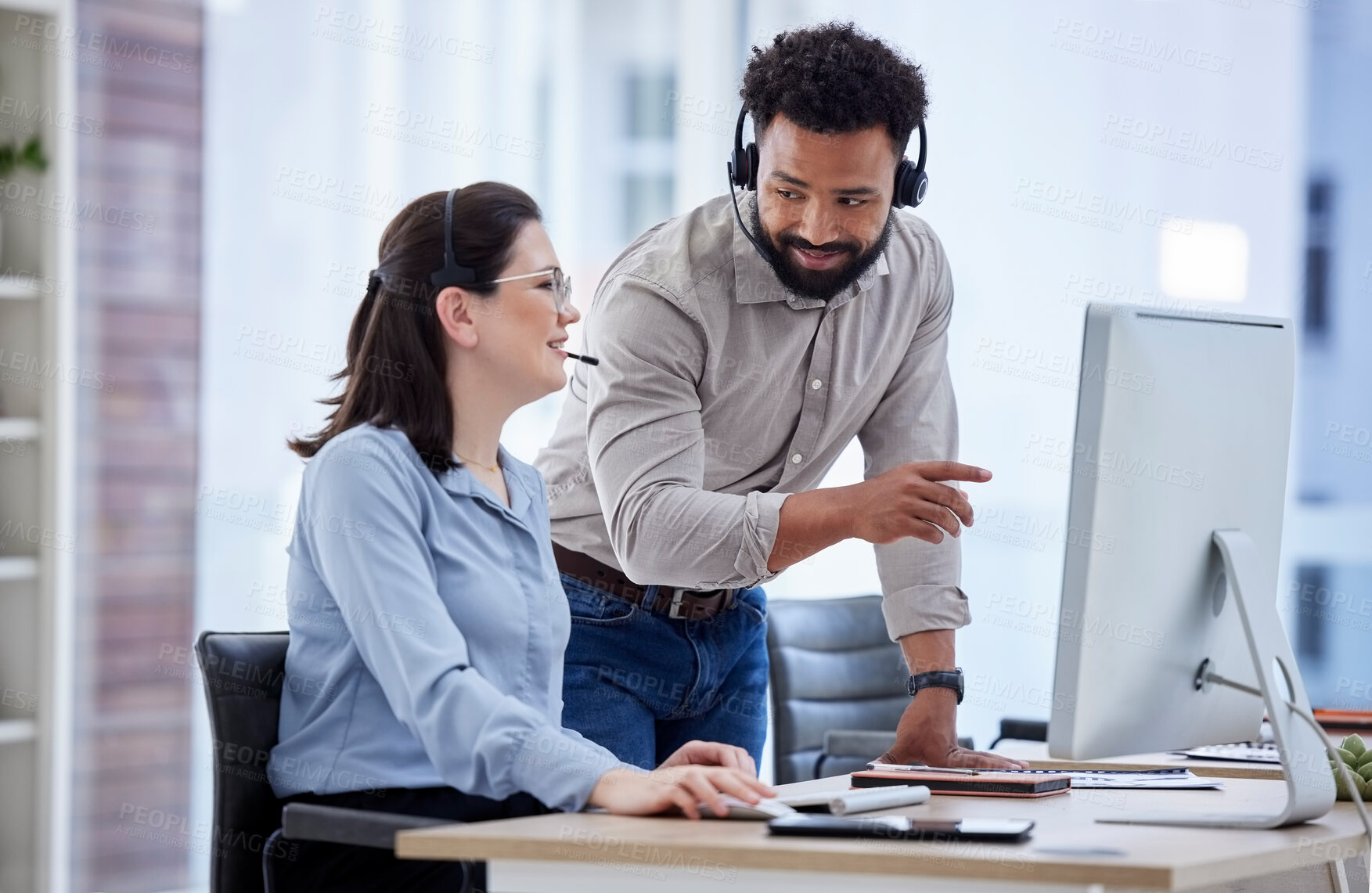 Buy stock photo Call center, manager and woman with telemarketing, help and advice with conversation, explain system and computer. Happy man, supervisor and agent in a workplace, customer service and tech support
