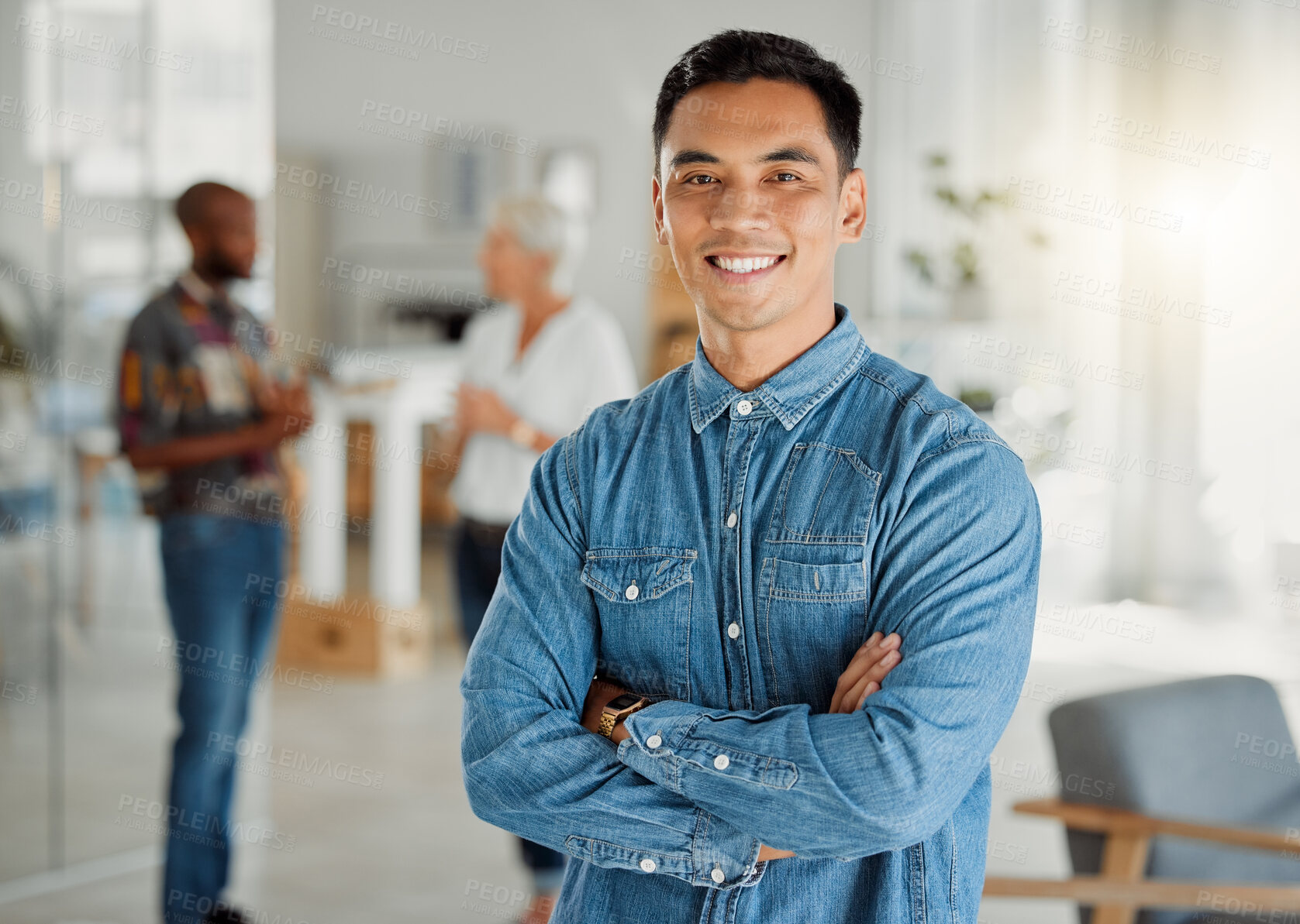 Buy stock photo Portrait of a happy asian businessman standing with his arms crossed at work. One confident chinese male manager standing in an office at work. One content expert business professional at work