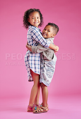 Buy stock photo Two children only posing and being affectionate against a pink copyspace background. African American mixed race siblings bonding in a studio