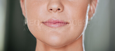 Closeup of unknown serious woman alone in gym. Headshot of focused caucasian trainer’s lips and mouth while standing after workout in health club. Coach in fitness centre for routine exercise training