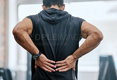 Buy stock photo Fitness, gym and man with hands on back pain, medical emergency and workout at sports studio. Exercise, health and wellness, bodybuilder with hand on muscle burnout or ache for massage while training