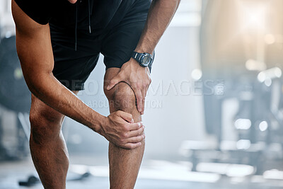 Buy stock photo Fitness, gym and mockup, man with knee pain and medical emergency from workout injury at sports studio. Exercise, health and wellness, bodybuilder with hand on leg muscle ache for relief at training.