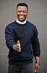 Closeup Portrait of a young african american businessman holding his hand out for a handshake in a outside in the city