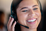 One happy young smiling caucasian call centre telemarketing agent talking on headset in office. Face of confident and friendly businesswoman operating helpdesk for customer service and sales support