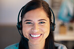 Portrait of one happy young smiling caucasian call centre telemarketing agent talking on headset in office. Face of confident and friendly businesswoman operating helpdesk for customer service and sales support