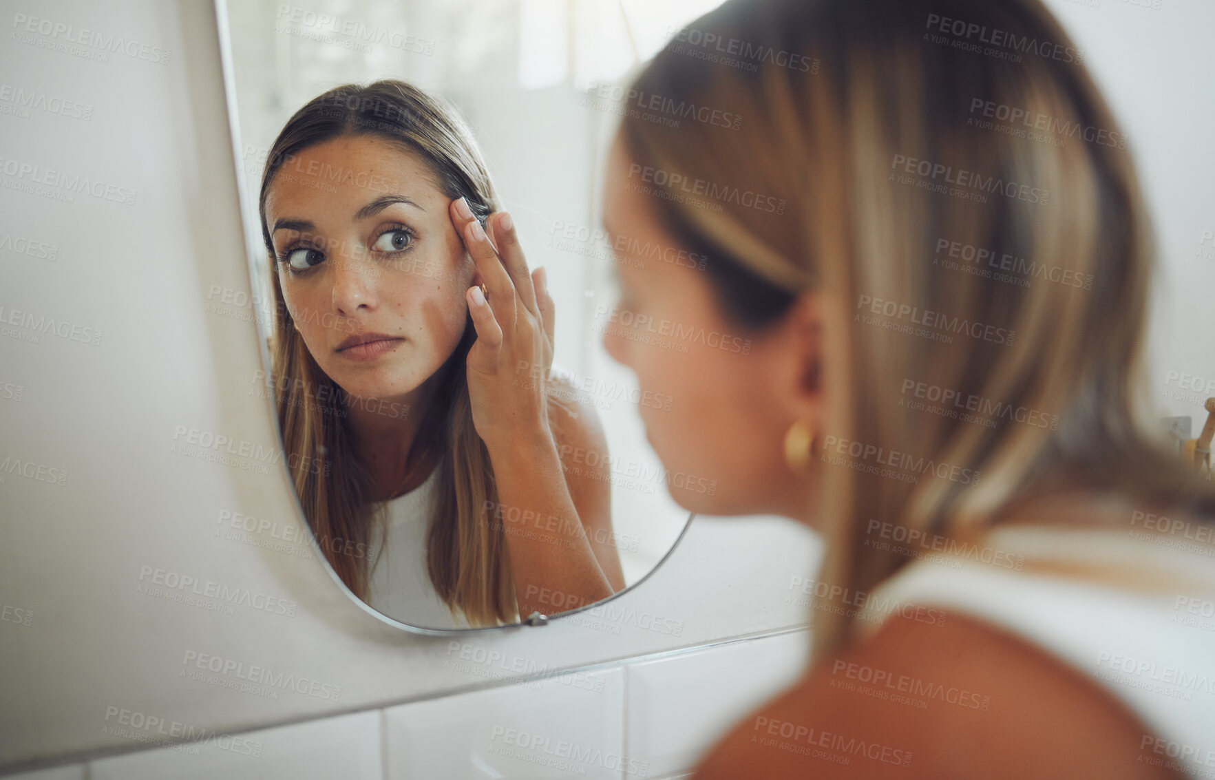 Buy stock photo Woman, bathroom and checking face in mirror for acne breakout, pimple inspection or beauty routine. Skincare, person and reflection for cosmetics facial results, analysis or hyperpigmentation in home