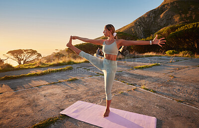 Buy stock photo Full length yoga woman holding hand to toe pose in outdoor practice in remote nature. Beautiful caucasian person using mat, balancing while stretching alone at sunset. Young, active, zen and serene