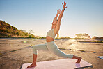 Full length yoga woman holding crescent moon pose in outdoor practice in remote nature. Beautiful caucasian person using mat, balancing while stretching alone at sunset. Young, active, zen and serene