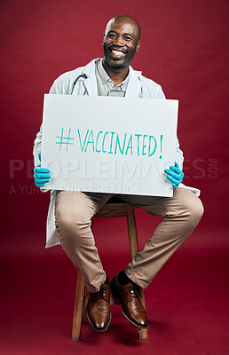 Buy stock photo African american covid doctor holding and showing poster. Full length portrait of smiling black physician isolated against red studio background with copyspace. Man promoting corona vaccine on sign