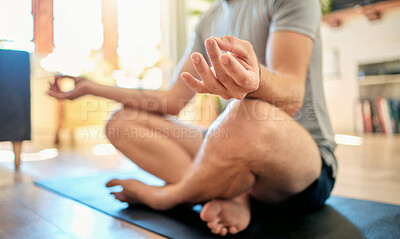 Buy stock photo Closeup of one caucasian man sitting with legs crossed and meditating in harmony with om finger gesture while practising yoga at home. Hands of calm, relaxed and focused guy feeling zen while praying quietly for stress relief and peace of mind