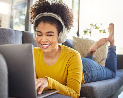 Buy stock photo Laptop, headphones and woman relax on sofa for e learning, online education and audio translation or website service. Happy student or african person on couch, audio technology and computer for home