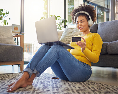 Buy stock photo Headphones, credit card and woman on laptop for home online shopping, ecommerce or fintech payment on floor. Relax, music and happy african person on internet banking, audio subscription and computer