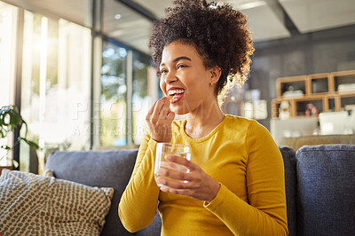 Buy stock photo Glass, water and woman with medicine on sofa for health, self care and supplement at home. Relax, healthcare and happy african person with liquid drink and pill or tablet for wellness on couch