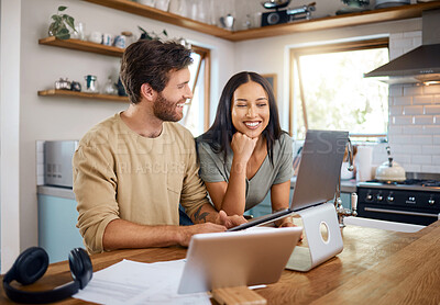 Buy stock photo Happy young caucasian man working on laptop while his wife stands next to him looking at the screen. Man doing freelance work and getting distracted by beautiful wife